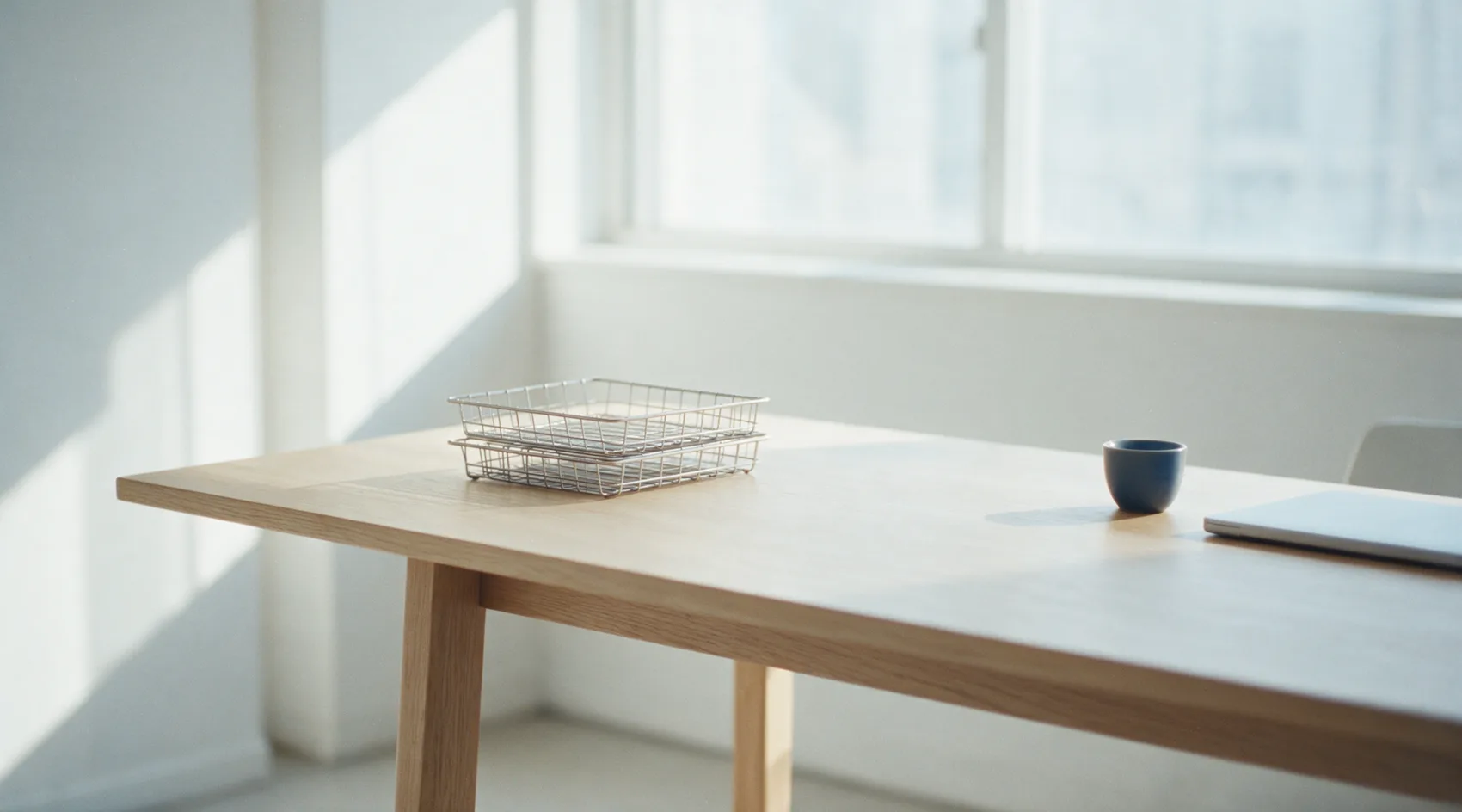 The same desk as the opening, now completely clear with both trays empty